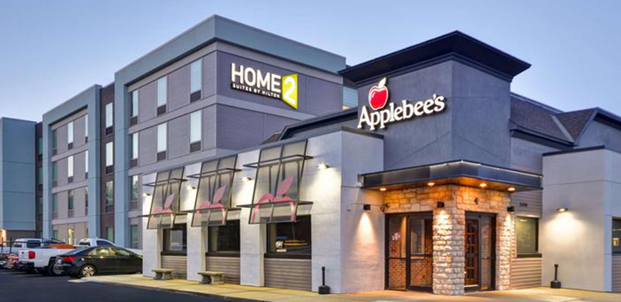 Photo of HOME hotel and Applebee's restaurant.